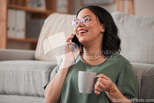 Image of Woman, coffee and phone call in living room for communication, contact or conversation. Happy person, drinking tea or talking on smartphone for networking, chat connection or mobile tech at home