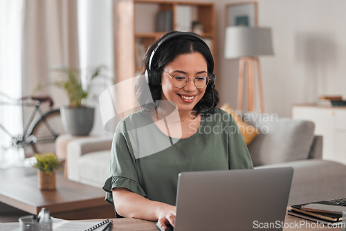 Image of Happy, remote work and woman with a laptop for call center communication and consultation. Smile, virtual assistant and a customer service agent typing on a computer from a house for telemarketing