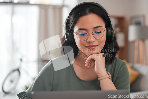 Image of Woman, remote work and virtual assistant with headphones at laptop for video call, voip communication and telemarketing. Female consultant, computer and microphone for customer support at home office