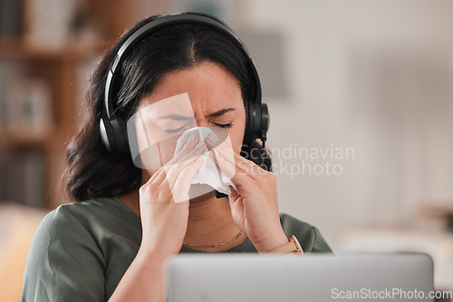 Image of Woman, sick and blowing nose in work from home office for allergies, cold virus and flu risk of telemarketing consultant. Female virtual assistant, sales agent or sneeze at laptop for allergy problem