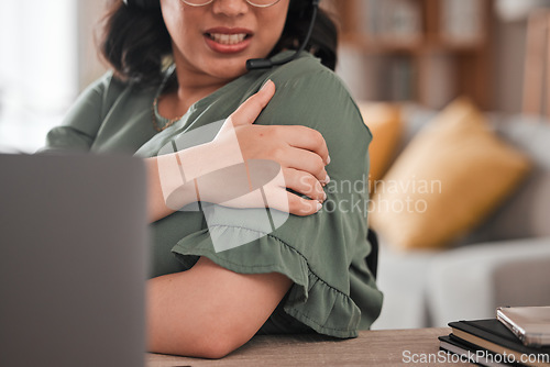 Image of Woman, hands and shoulder pain in remote work from injury, stress or burnout at home office. Closeup of female person freelancer with sore arm, ache or inflammation in discomfort, mistake or accident