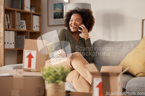 Image of Phone call, boxes and woman in new home, real estate and property investment with online communication. Conversation, talking and happy african person for moving services in living room, sofa or home