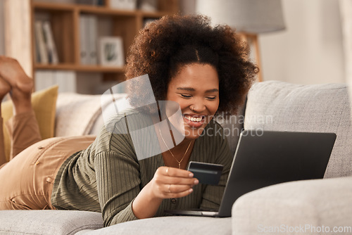 Image of Black woman, credit card and laptop on sofa for online shopping, digital payment and fintech account. Happy female person, computer banking and money for sales, password and ecommerce finance at home