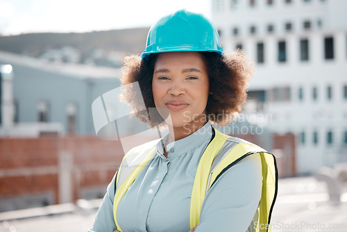Image of Portrait, engineer and confident woman on city rooftop for career in renewable energy. Face, architect and serious developer, solar contractor with helmet and employee from South Africa outdoor
