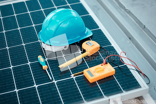 Image of Solar panels, tools and helmet, maintenance and clean energy with natural power supply and electricity. Sustainability, eco friendly technology and construction, technician equipment and photovoltaic