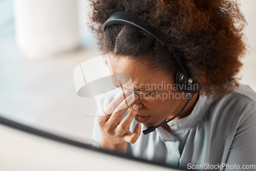 Image of Woman, headache and call center in office, headphones and microphone for crm expert with pain. African girl, customer service and burnout with stress for contact us, help desk or telemarketing career