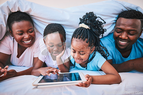 Image of Happy, black family and tablet in bed for cartoon, learning or streaming a movie together. Education, relax and children with African parents and technology for games, internet or an app in a house