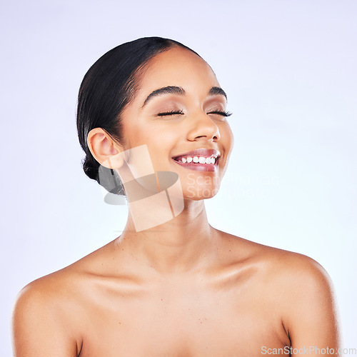 Image of Thinking, smile and woman with skincare, beauty and dermatology against a white studio background. Female person, happiness and model with cosmetics, bare and ideas with aesthetic, health or wellness