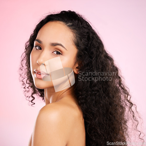 Image of Beauty, portrait and skincare with african woman for glow with dermatology on body and pink background. Facial treatment, haircare and black girl with a natural face in studio for luxury treatment.