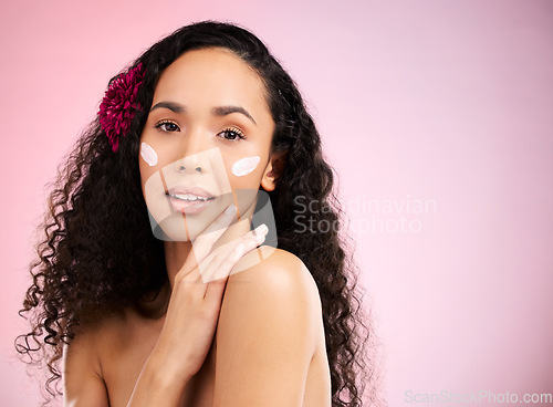 Image of Skincare, cream and portrait of woman with flower in studio for wellness, facial treatment and cosmetics. Dermatology, spa and face of female person with anti aging product, moisturizer and lotion