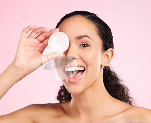 Image of Face, skincare and excited woman with cream container in studio isolated on a pink background. Portrait, natural and happy model with lotion, sunscreen cosmetic and dermatology product for wellness