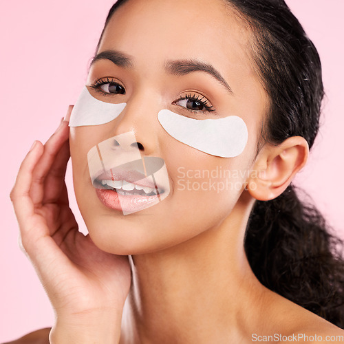 Image of Eye patch, face mask and beauty of a woman with natural skin glow on a pink background. Dermatology, collagen and cosmetics portrait of female model for facial shine, wellness or self care in studio