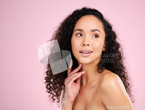 Image of Skincare, beauty and glow on african girl with body in studio or pink background for spa treatment. Haircare, natural curly and face with female person for healthy shine for dermatology or cosmetics.