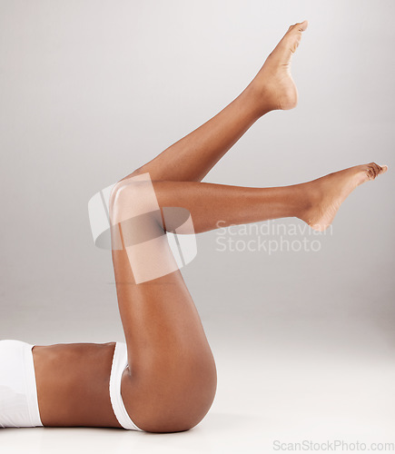 Image of Closeup, fitness and woman with skincare, legs or epilation against a white studio background. Zoom, female person or model with beauty, body or grooming with salon treatment or healthy with wellness
