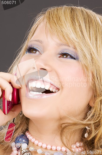 Image of happy girl with pink phone