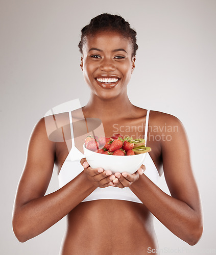 Image of Healthy, portrait and black woman with fruit on a studio background for a diet to lose weight. Happy, wellness and an African model or girl with breakfast food, morning nutrition or eating for detox