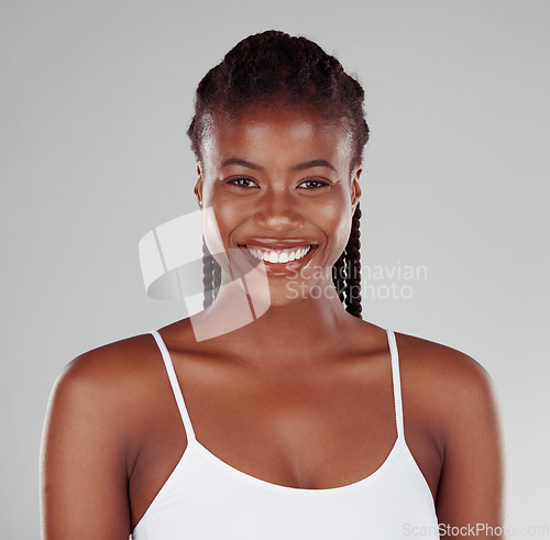 Image of Beauty, health and smile with portrait of black woman in studio for skincare, wellness or dermatology. Self care, cosmetics and happy with female model on gray background for glow, natural and makeup