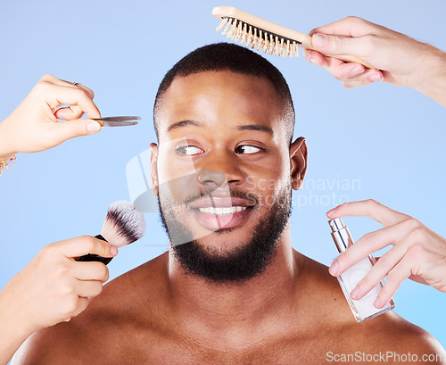 Image of Self care, hands and man with beauty products in a studio for natural, face and grooming routine. Skincare, wellness and young male model with health and hygiene treatment isolated by blue background