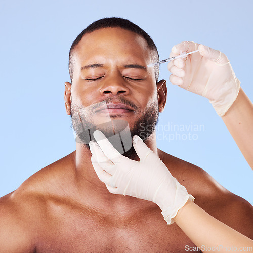Image of Needle, scared man and plastic surgery of skincare process, filler and aesthetic prp in studio. Face of black male model with fear, pain and anxiety for injection, facial change and blue background