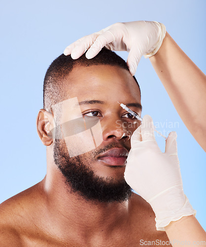 Image of Black man, plastic surgery and needle in studio for beauty, dermatology or face transformation by background. African patient, model or surgeon hands for skincare, syringe or eye filler for aesthetic