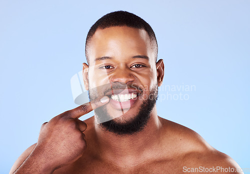 Image of Teeth, dental care and portrait of black man mouth after cleaning or hygiene isolated in a blue studio background. Healthcare, dentist and happy person showing his oral beauty smile for health