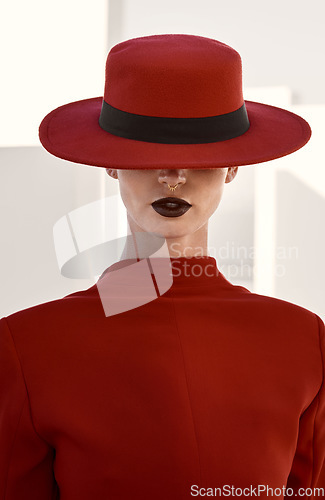 Image of Beauty, fashion and mysterious woman in a studio with a glamour, face and makeup routine. Stylish, classy and female model with fancy hat for accessory with elegant style isolated by white background