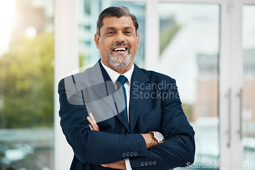 Image of Pride, portrait and a mature businessman with arms crossed for office or company management. Smile, work and a corporate employee with confidence, happiness and professional mindset for executive job