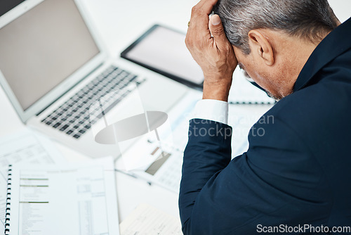 Image of Headache, laptop and business man stress in financial crisis, report or stock market crash of documents review. Pain, frustrated or sad executive, CEO or person for online accounting or taxes mistake