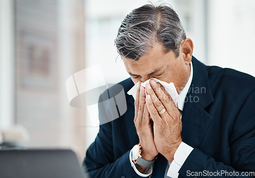 Image of Sick, mature man and blowing nose in office with allergy, covid or virus in business company. Tissue paper, professional or manager with allergies for health problem, cold fever or bacteria in winter