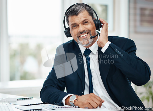 Image of Portrait, call center and mature man happy for business, customer service and listening for support. Face smile, telemarketing and professional, sales agent or consultant working at help desk for crm