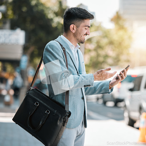 Image of Phone, app and a business man in the city for travel on his morning commute into work during summer. Mobile, social media or networking with a happy young male employee on an urban street in town