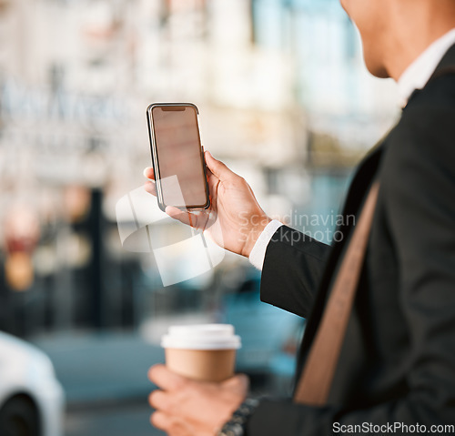 Image of Hand, phone and location with a business man in the city, searching a map on his morning commute for work. Mobile, app and navigation with a male employee following directions on an urban street