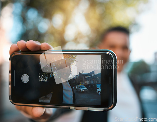 Image of Selfie, phone screen and business man in city for social media, profile picture and online post. Travel, professional and face of male worker with hand gesture excited for career, job and success