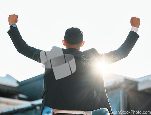 Image of Back, win and a businessman with success in city for a corporate win, achievement or celebration. Sunshine, motivation and an excited employee with freedom from work, promotion or professional bonus