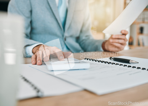 Image of Accounting paperwork, hands and calculator for an audit, finance administration or planning report. Desk, work and an accountant with documents in an office for analysis, bookkeeping or budget