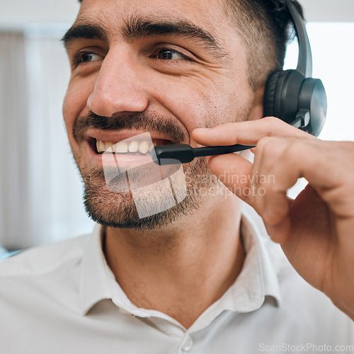 Image of Call center, man or face of happy consultant for customer service, business support or CRM communication. Salesman, agent and smile with microphone for telemarketing, telecom contact or FAQ questions