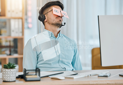 Image of Tired, sleeping and business man with sticky notes on eyes from low energy and burnout in office. Fatigue, nap and rest of a male professional with drawing on glasses to pretend at a company