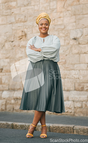 Image of Portrait, happy and city with a business black woman standing arms crossed outdoor for management. Leadership, mindset and smile with a confident female CEO, manager or boss in an urban town