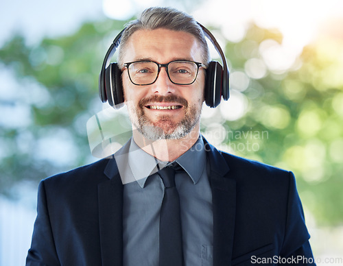 Image of Face, mature and business man with headphones outdoor for music podcast. Portrait, accountant and happy ceo listening to radio, audio or hearing sound with smile for jazz, hip hop and song on bokeh.