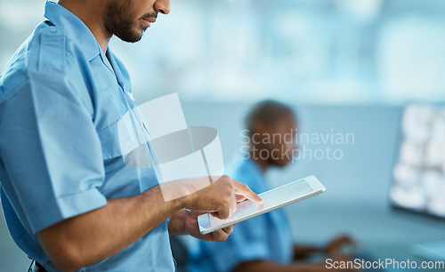 Image of Man, hands and security guard on tablet for surveillance, search or browsing at the office. Male person, law enforcement or officer working on technology for emergency check or safety inspection