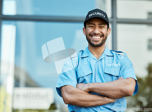 Image of Happy man, portrait and security guard with arms crossed in city for career safety or outdoor protection. Male person, police or officer smile in confidence, law enforcement or patrol in urban town