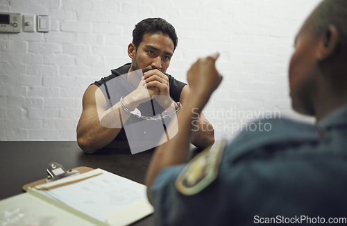 Image of Man, criminal and handcuffs with police for interrogation, crime or money laundering in arrest. Woman officer pointing to male person, gangster or suspect in jail and justice for fraud, theft or scam