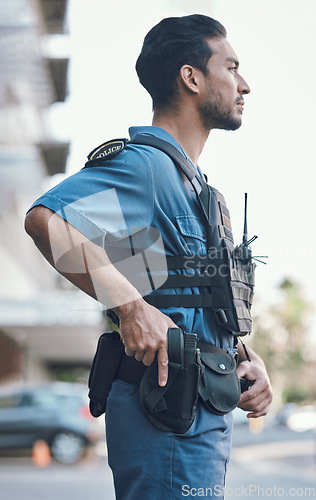 Image of Security, police and man with gun in city for working, inspection and supervision on patrol shift. Surveillance, law enforcement and male person in urban town for safety, crime and protection service