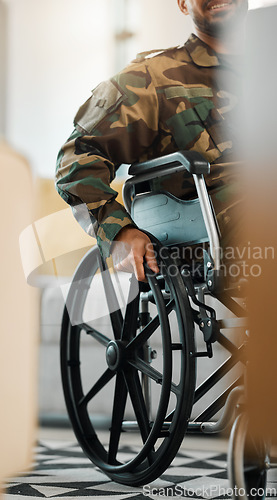 Image of Military, city and a man from the army in a wheelchair, war injury or rehabilitation. Hands, support and a person, soldier or hero with a disability as a veteran in mobility recovery in the street