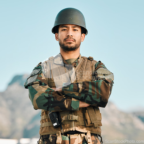 Image of Portrait, soldier and asian man with arms crossed in city for power, confidence and mindset outdoor. War, military and face of Japanese guy warrior proud, hero or ready for army, security or training