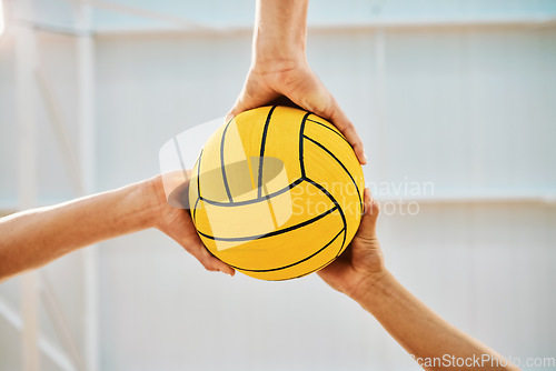 Image of Hands, teamwork and water polo with sports people holding a ball in a gym for fitness or training from below. Exercise, game and solidarity with a group of athletes in a health center for a workout