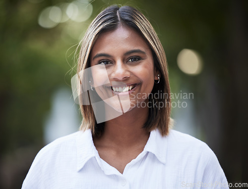 Image of Portrait, smile and confident with a woman in nature, outdoor on a green background for travel or freedom. Face, happy and a carefree young female person standing in a park for fresh air or adventure