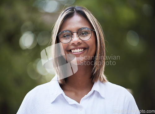 Image of Portrait, smile and glasses with a woman in nature, outdoor on a green background for travel or freedom. Face, eyewear and a happy young female person standing in a park for vision or eyesight