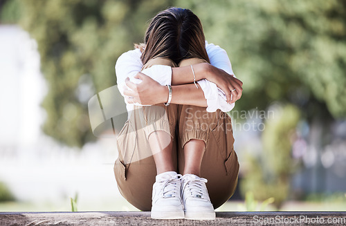 Image of Sad, depression and student with woman in park for cry, frustrated and stress. Mental health, anxiety and fear with female person in nature for psychology, tired and fatigue with mockup space