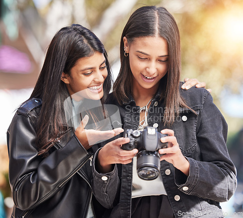 Image of Photography camera, city and happy friends check photo, picture or urban photographer, women or tourist shooting. Creative photoshoot, sidewalk and gen z youth, students or young people analyse shot